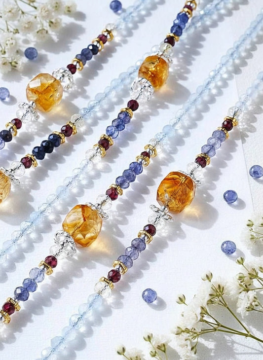 Colorful beaded necklace with amber stones on a white background with flowers
