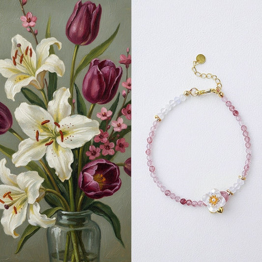Bouquet of flowers with a bracelet featuring floral designs on a white background