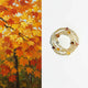Stack of beaded bracelets on a white background with an autumn leaf painting on the left.