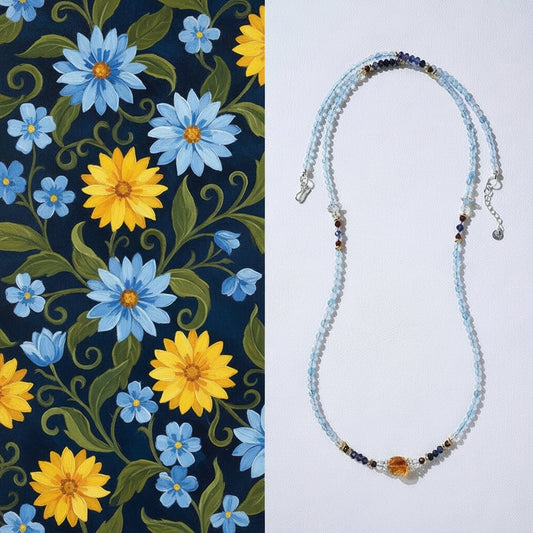 Beaded necklace with floral pattern on a blue and yellow floral fabric background