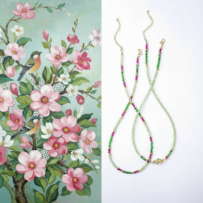 Two necklaces with floral patterns on a white background