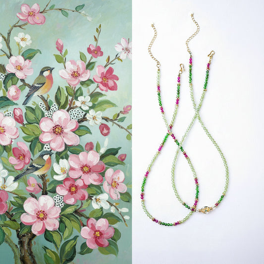 Two necklaces with floral patterns on a white background