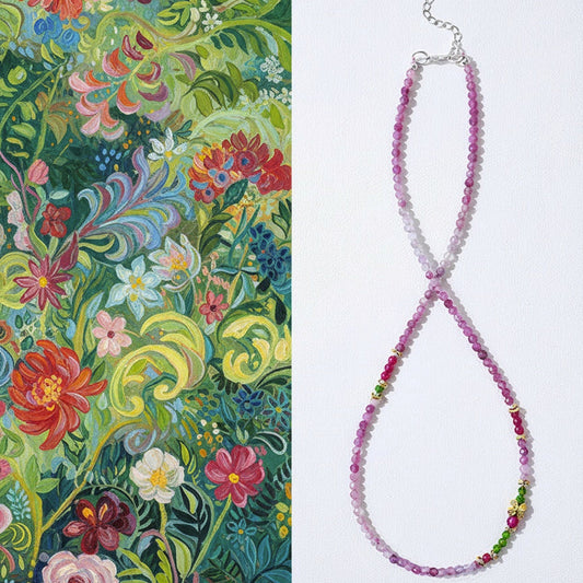 Beaded necklace with floral pattern on a white background