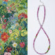 Beaded necklace with floral pattern on a white background