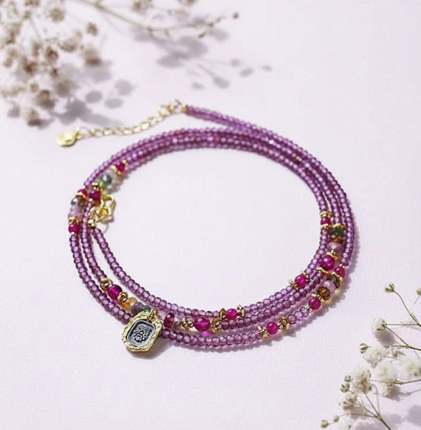 Multistrand beaded bracelet with colorful beads on a light pink background