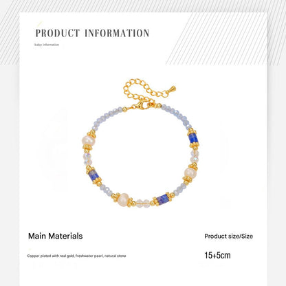 Multicolored beaded bracelet with gold chain on a white background