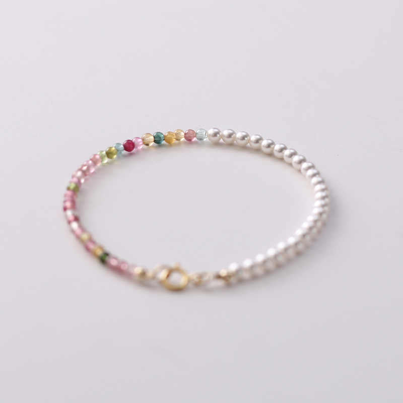 Beaded bracelet with multicolored beads on a white background