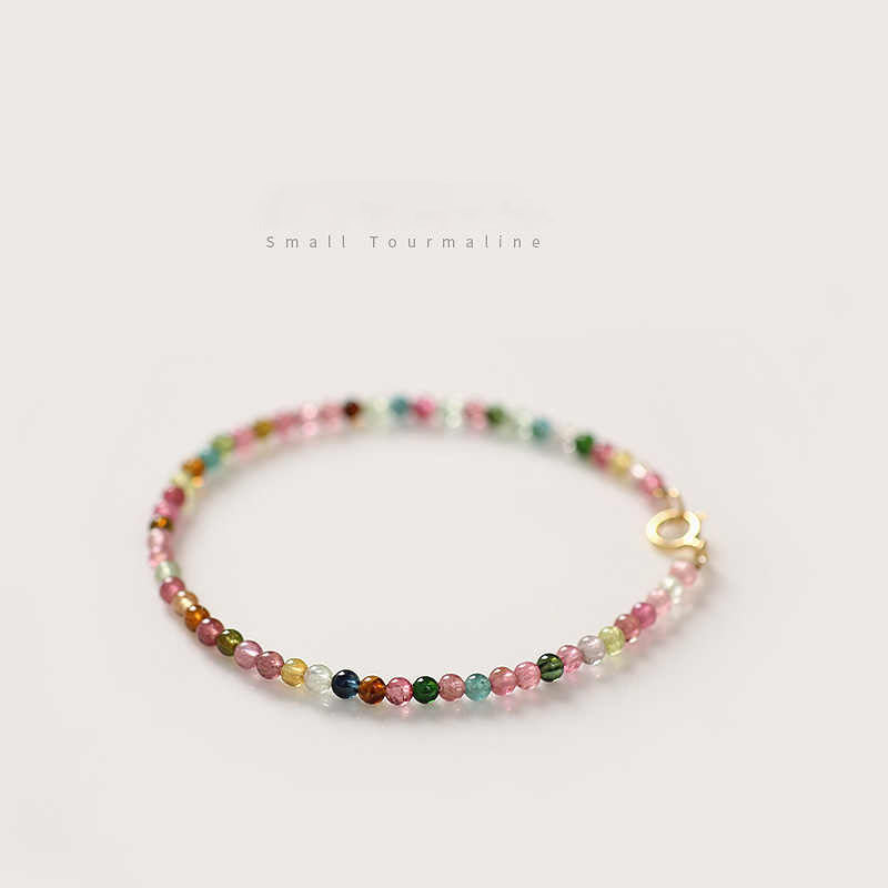 Multicolored beaded bracelet on a light background