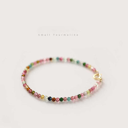 Multicolored beaded bracelet on a light background