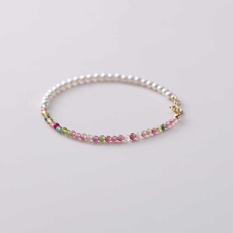 Multicolored beaded bracelet on a light background