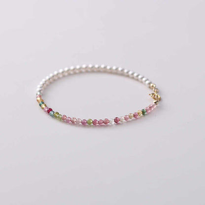 Multicolored beaded bracelet on a light background