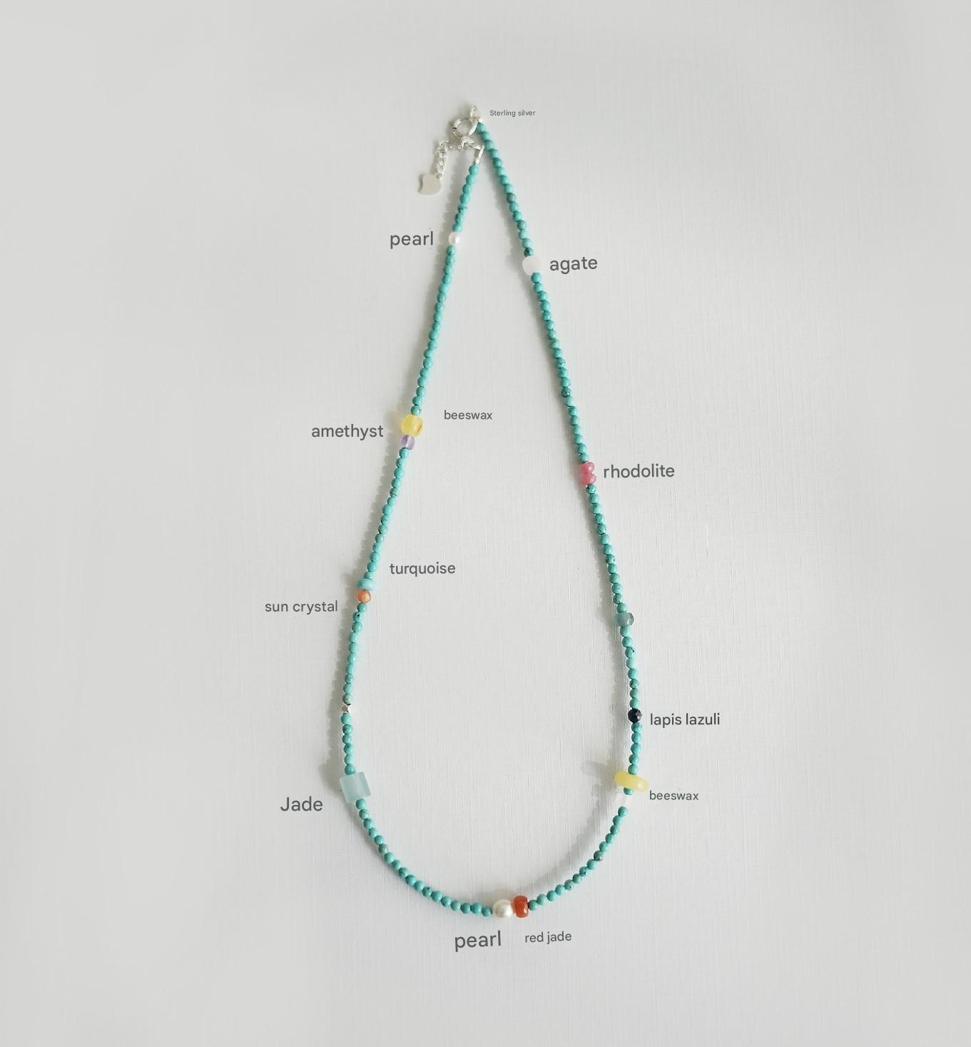 Necklace with colored beads on a white background