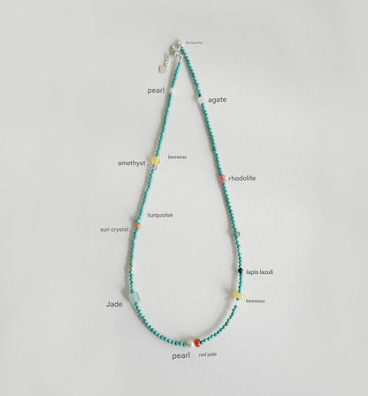 Necklace with colored beads on a white background