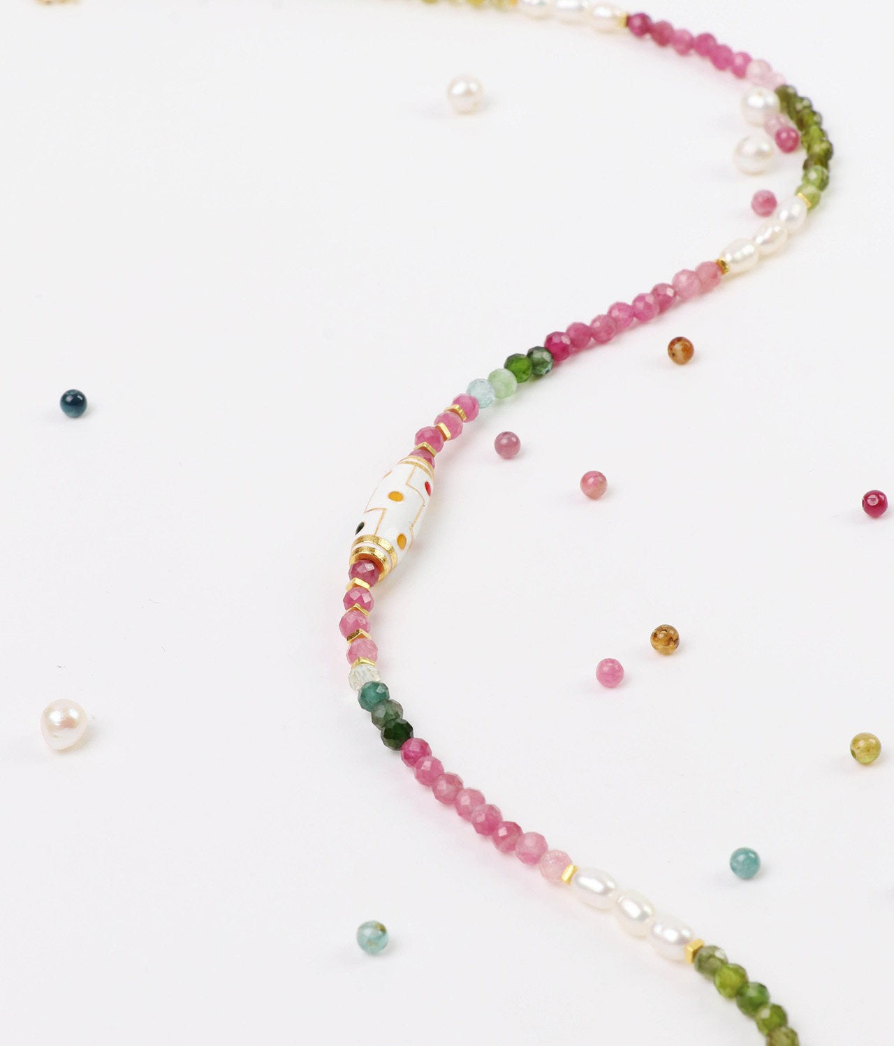 Multicolored beaded necklace on a white background