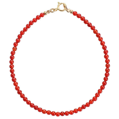 Red beaded necklace on a white background