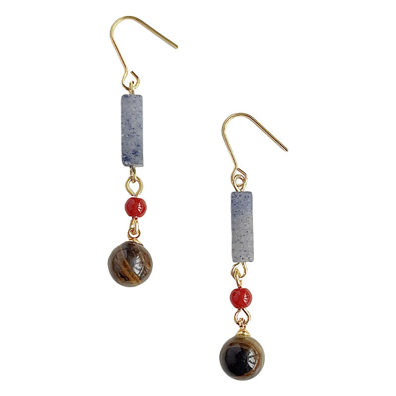 Pair of earrings with beads on a white background