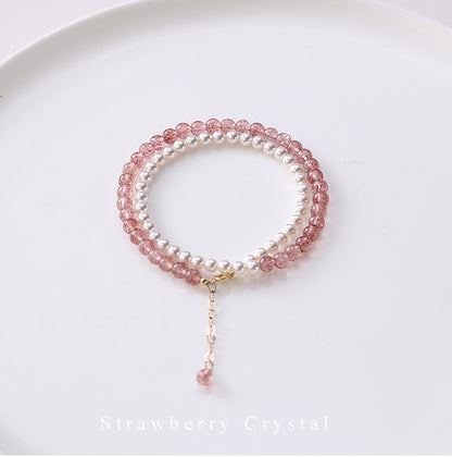 Bracelet with pink and white beads on a white background