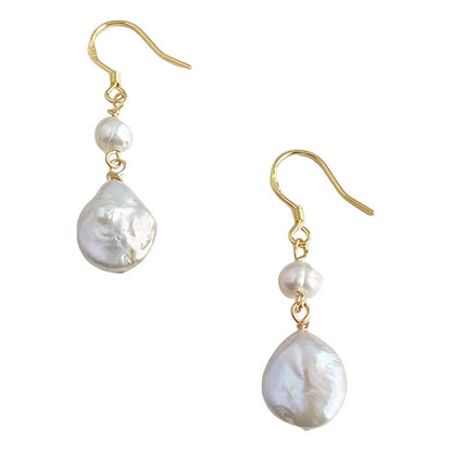 Pair of pearl earrings with gold hooks on a white background