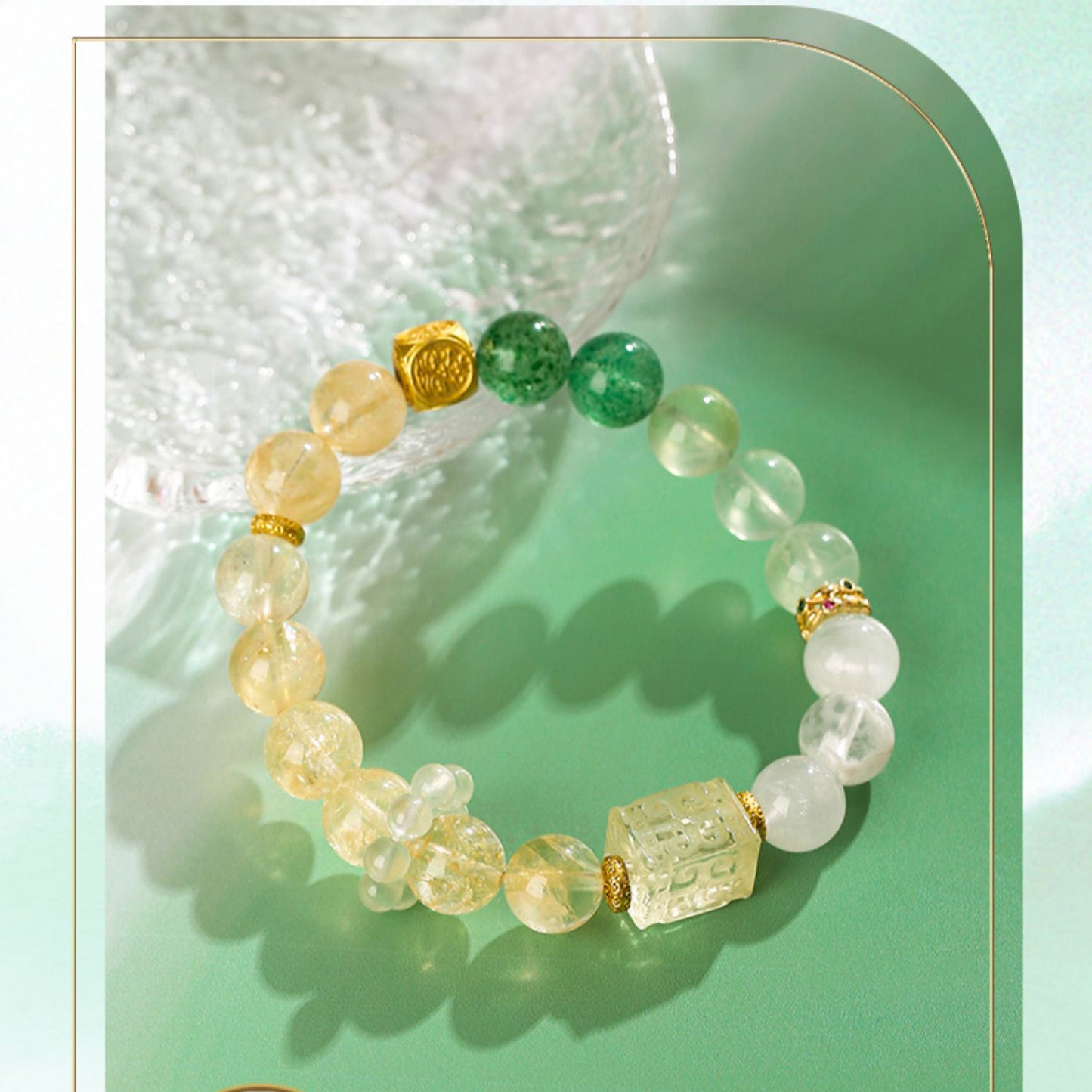 Beaded bracelet with green, yellow, and white stones on a light green background