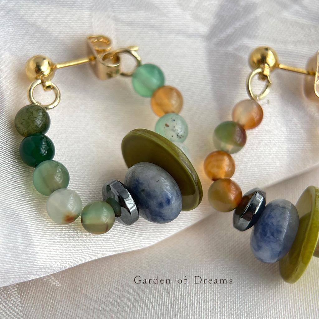Beaded bracelet with multicolored beads on a white fabric background