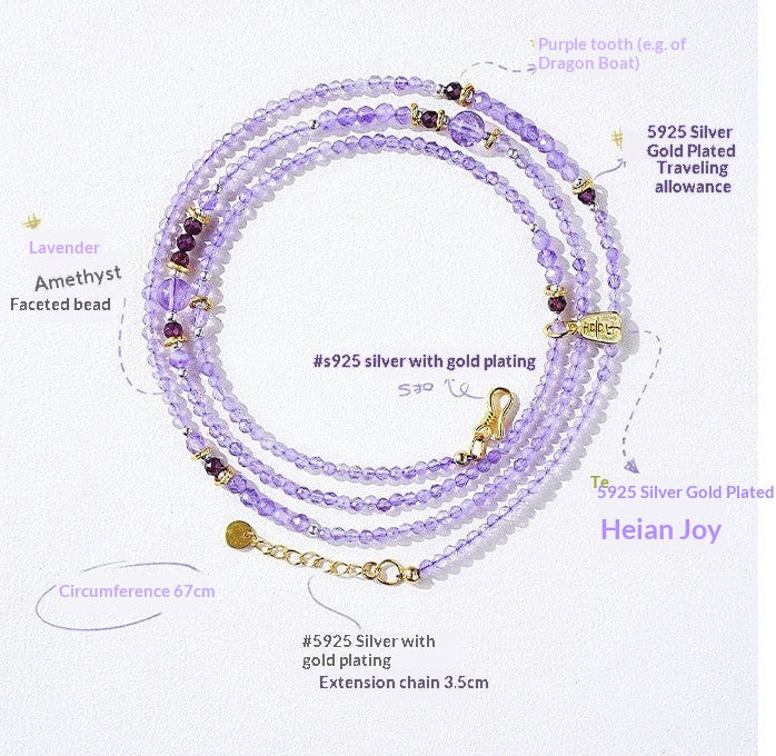 Purple beaded bracelet with gold accents on a white background