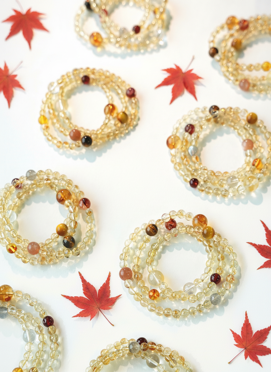 Decorative wreaths with beads on a white background with red leaves.