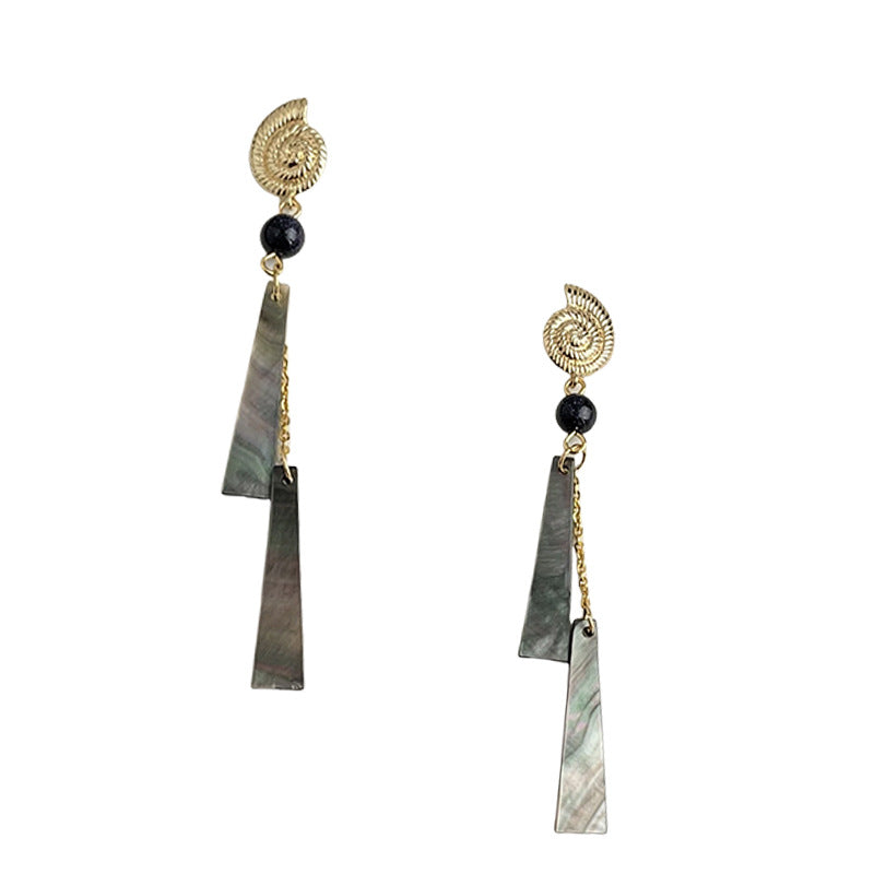 Pair of earrings with geometric shapes and gold accents on a white background