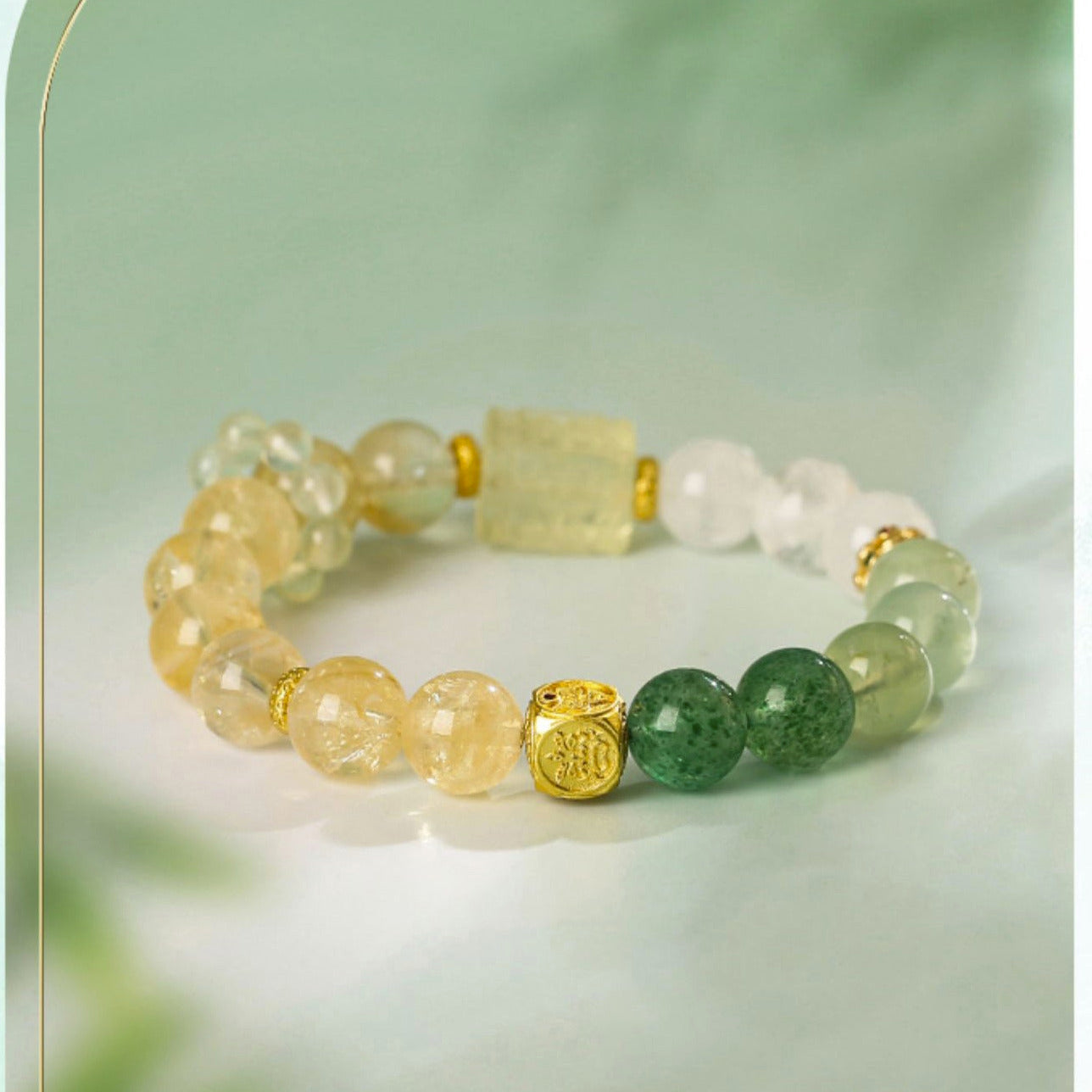 Beaded bracelet with yellow, green, and gold beads on a light green background, featuring the brand 'LUKY LIFE'.