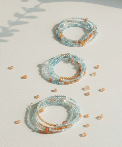 Set of beaded bracelets on a light surface with a soft shadow