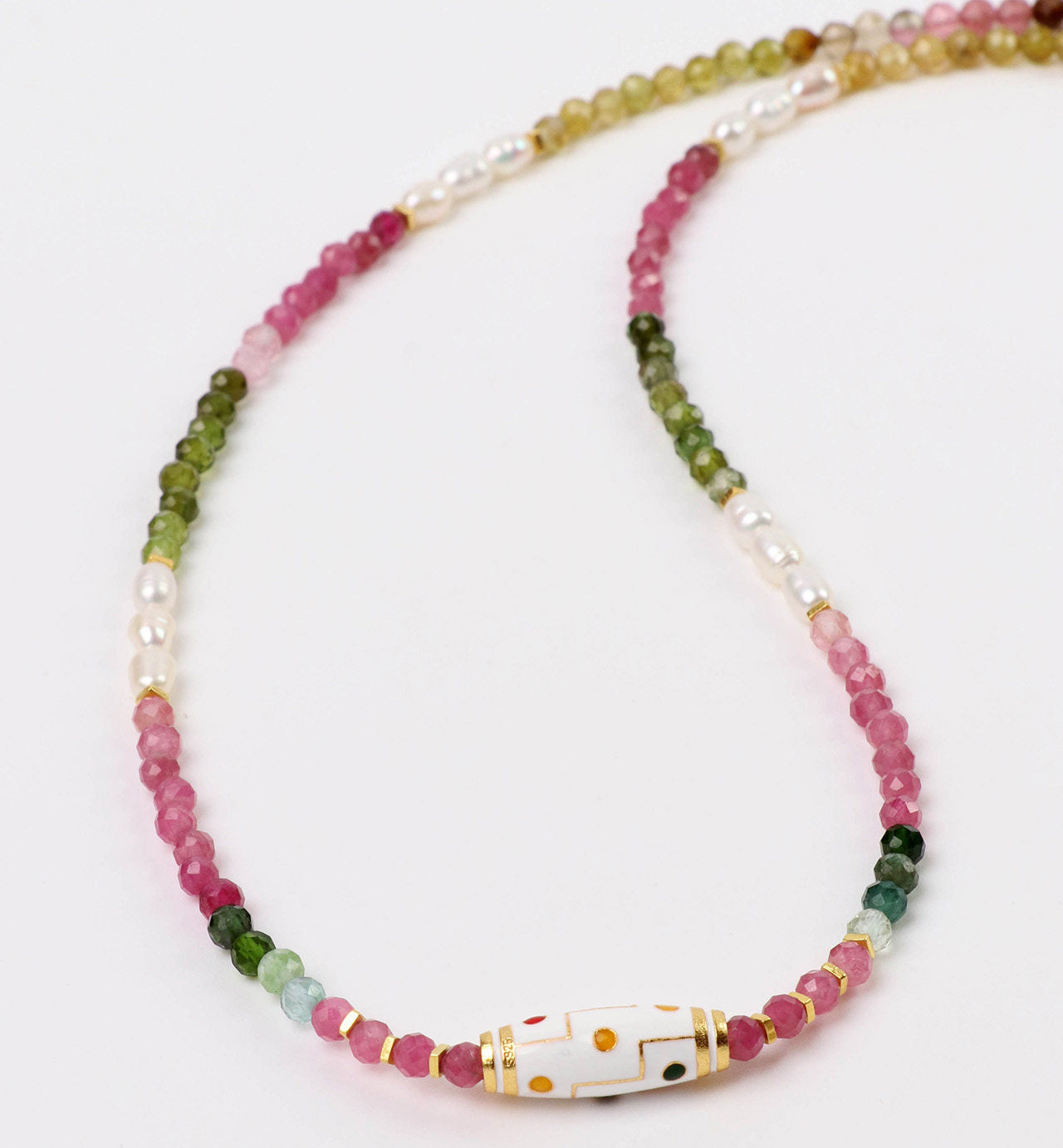 Beaded necklace with multicolored beads on a white background