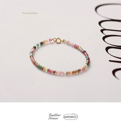 Multicolored beaded bracelet on a white background with 'Happiness' branding.