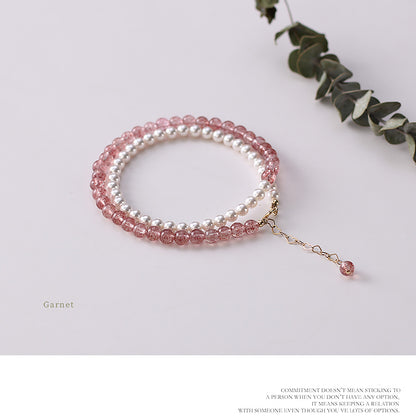 Beaded bracelet with pink and white beads on a light background.