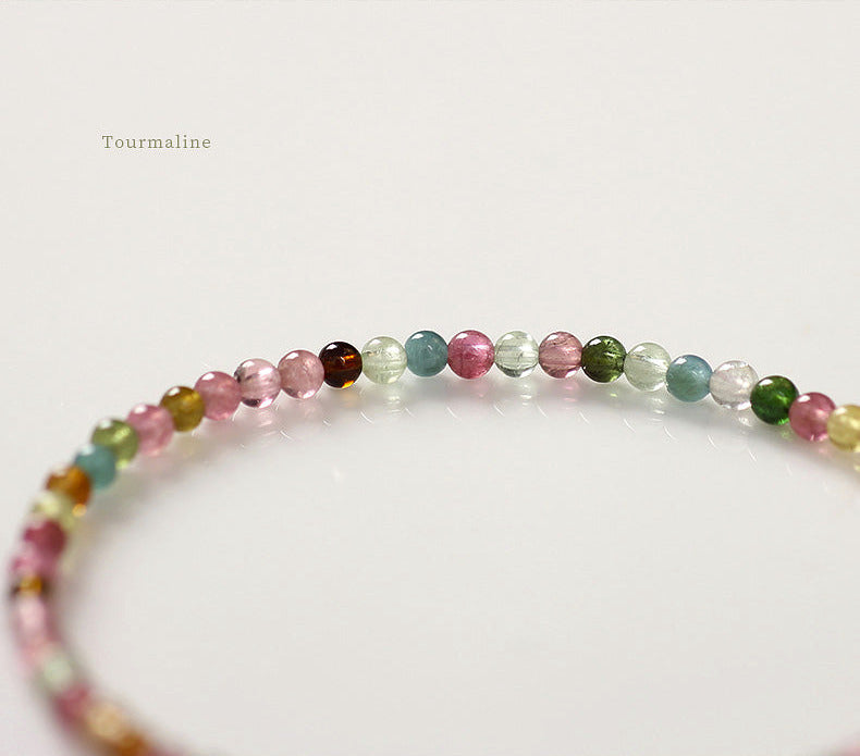 Multicolored beaded bracelet on a white background