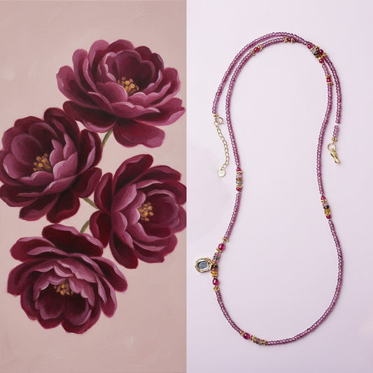 Beaded necklace with floral design on a pink background