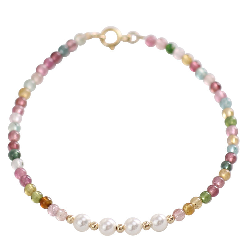 Multicolored beaded necklace with white pearls on a white background
