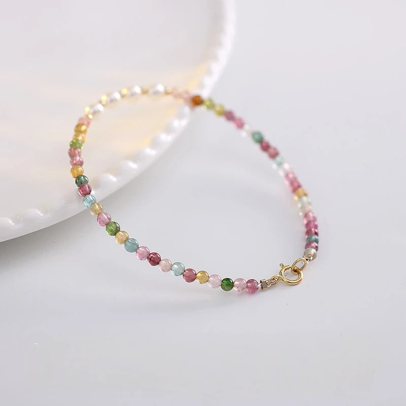 Multicolored beaded bracelet on a white dish