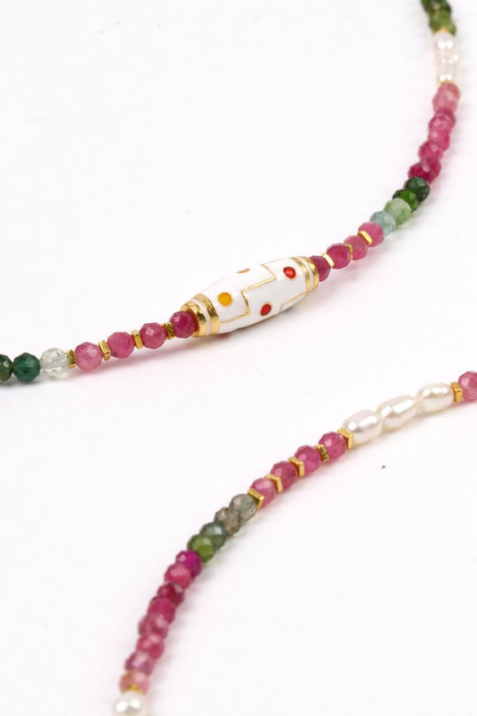 Necklace with multicolored beads on a white background