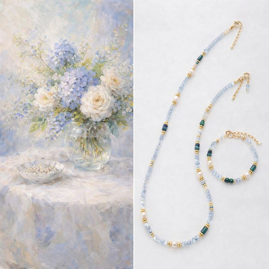 Beaded necklace and bracelet set with a still life painting of flowers and jewelry.