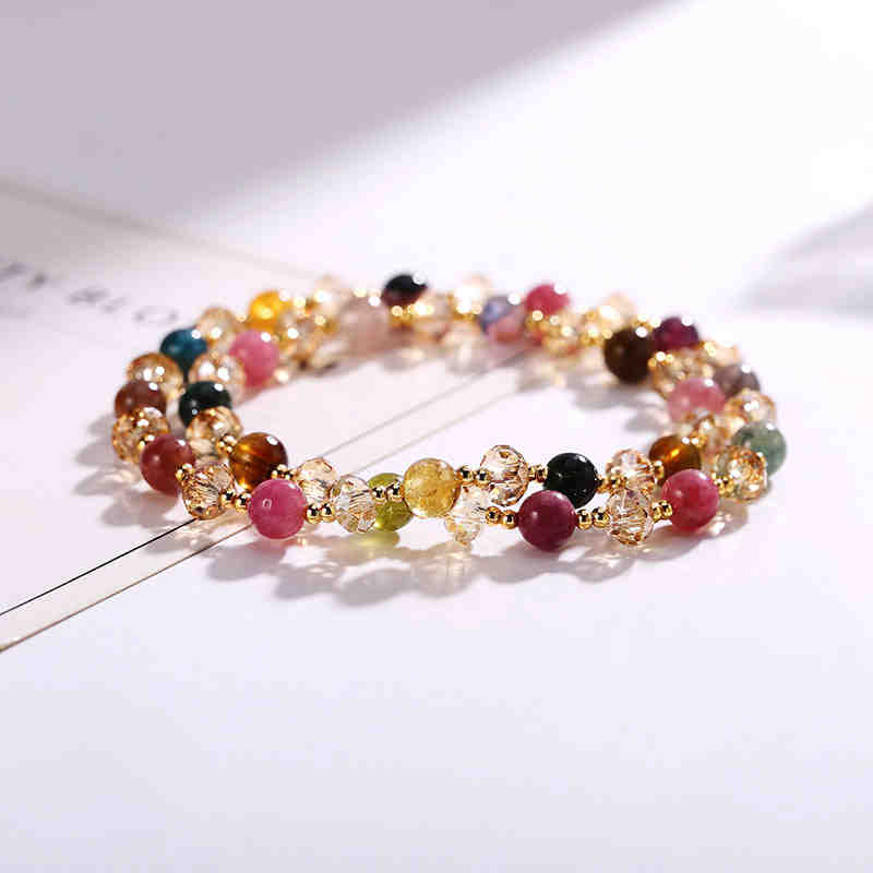 Multicolored beaded bracelet on a white surface