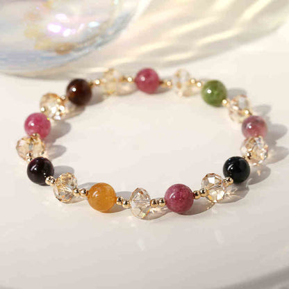 Multicolored beaded bracelet on a white surface