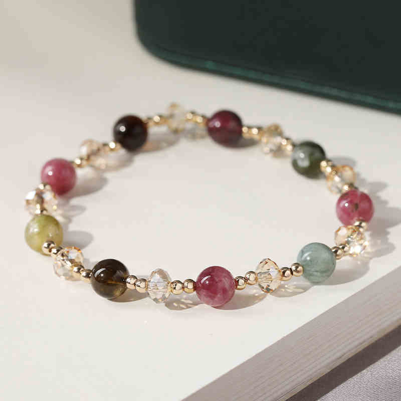 Multicolored beaded bracelet on a light surface
